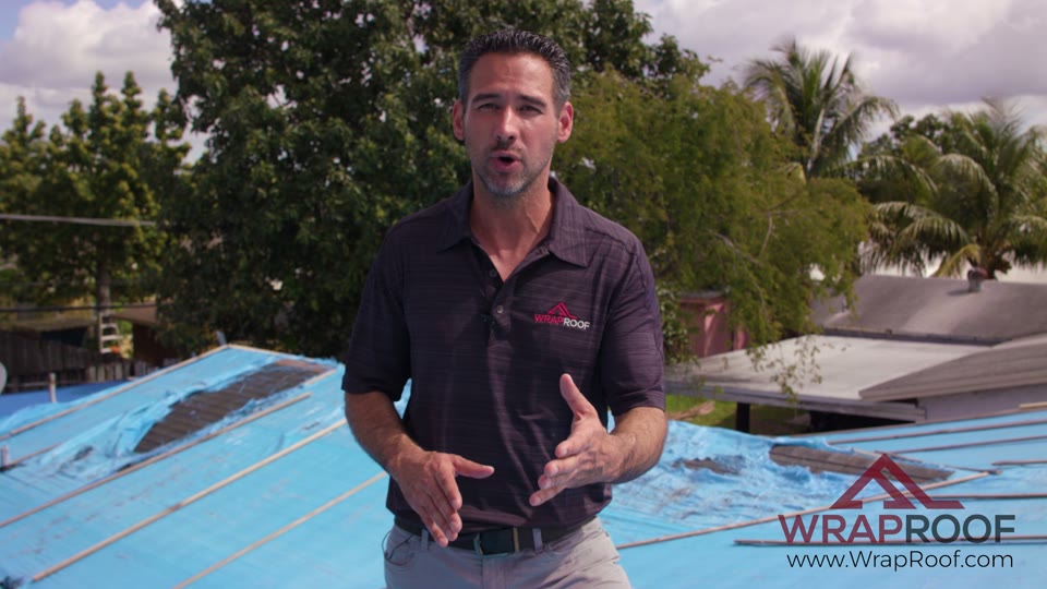Wraproof installer on a residential roof