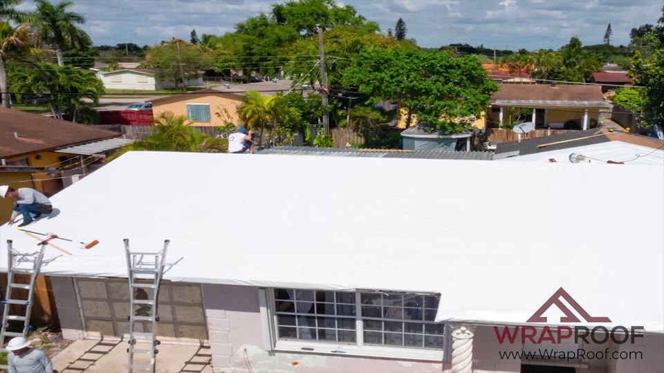Aerial view of a shingle roof sealed white fascia to ridge under Wraproof