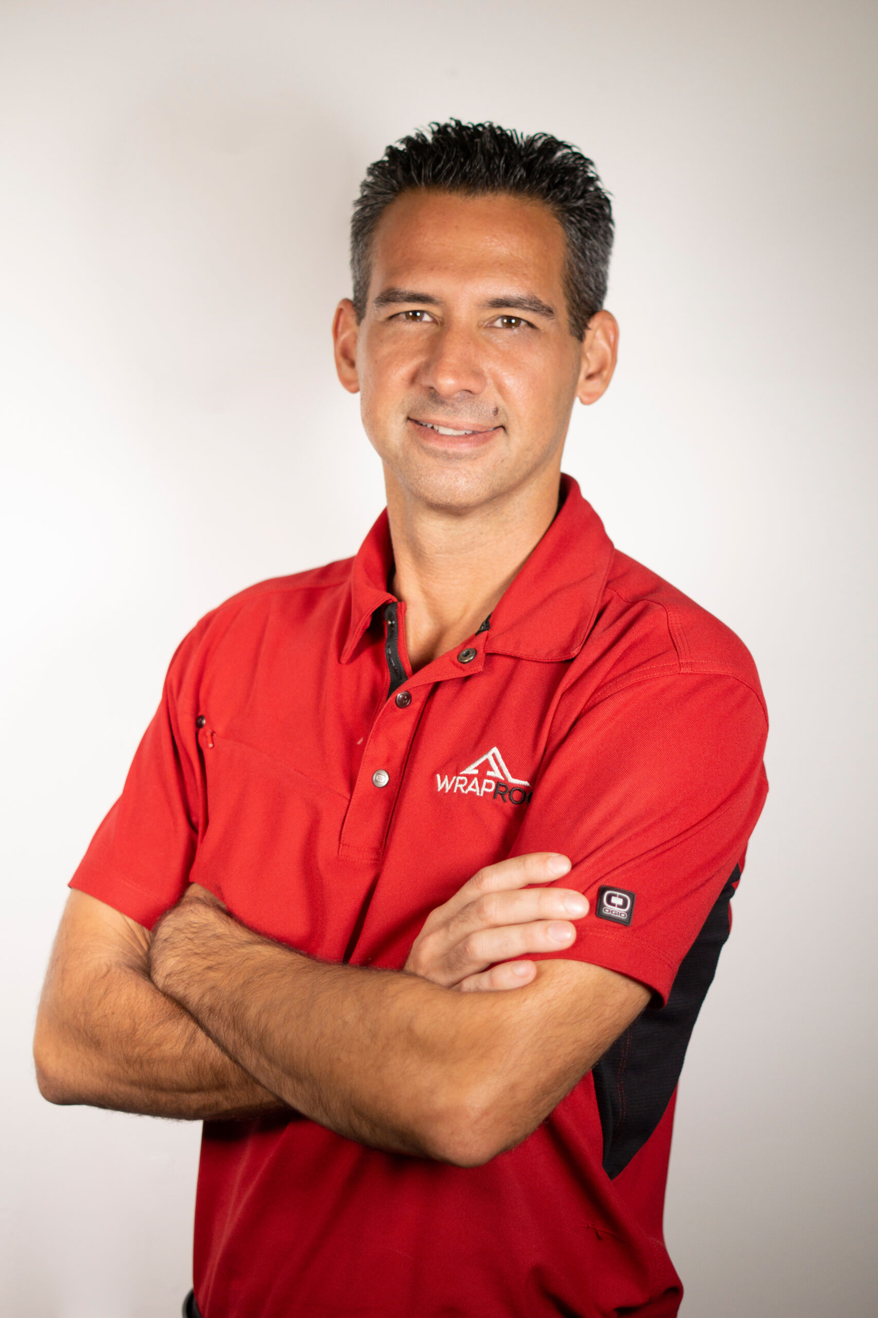 Larry Bond headshot red polo